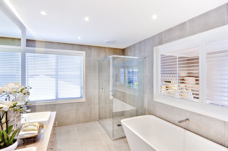 Modern bathroom with a washbasin and shower area